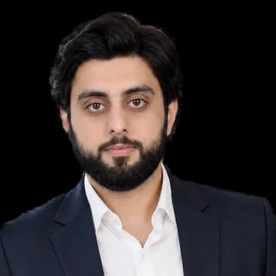 Haider Bajwa, the Launch VRO founder, in a navy blazer and white shirt.